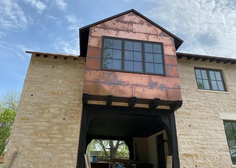 Copper metal panel facade on a stone building for Metal Roof Coating in Brookhaven